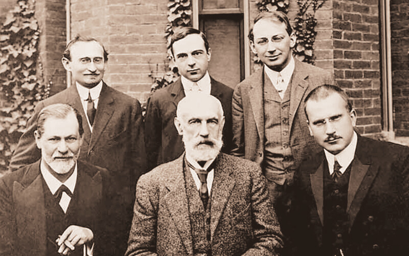 Sigmund Freud and his colleagues with Stanley Hall at Clark University, USA, in 1909. Standing (L to R): A. A. Brill, Ernest Jones, Sándor Ferenczi. Seated: Sigmund Freud, G. Stanley Hall, Carl Jung.